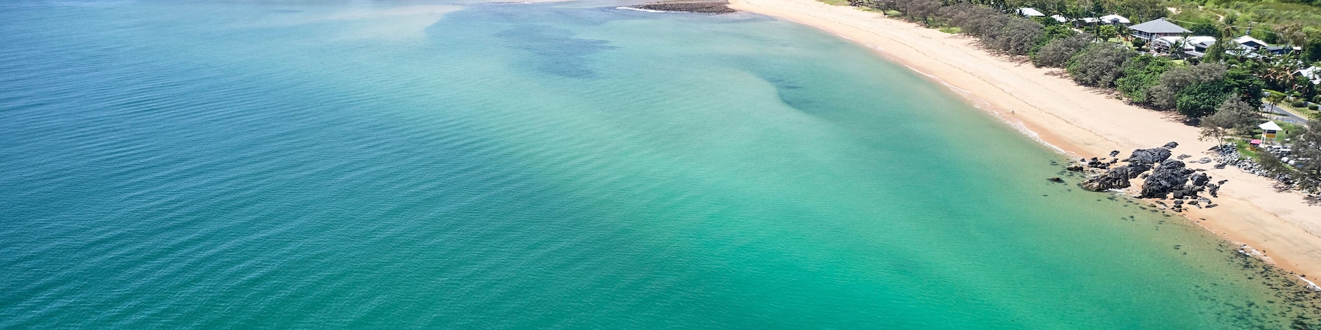 Mackay region and Whitsundays aerial drone image with blue water and rivers over sand banks