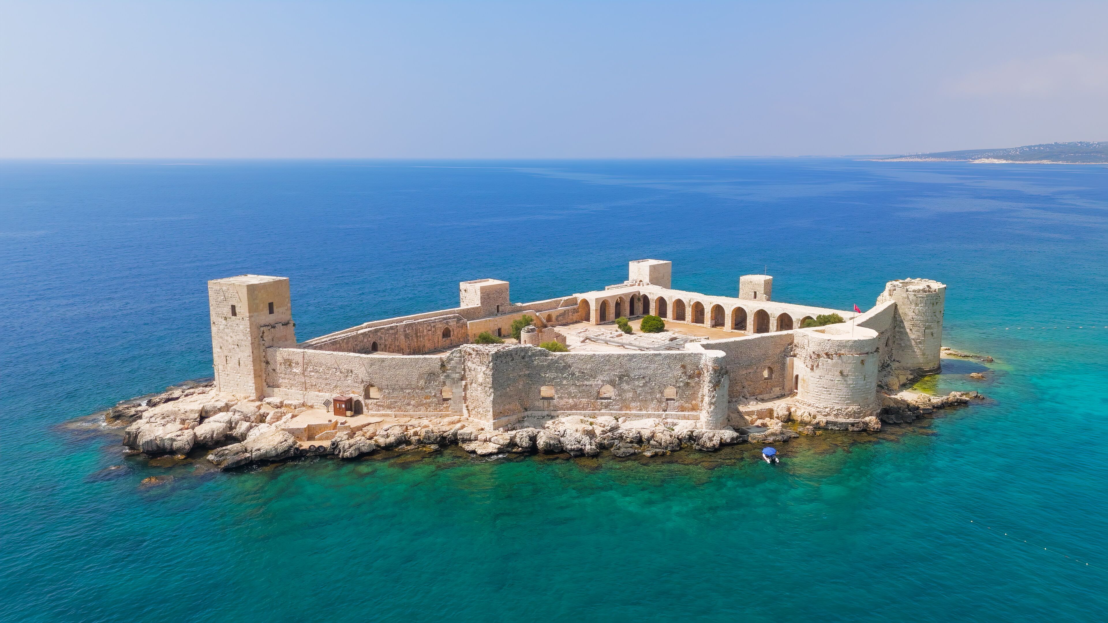Kizkalesi, Mersin, Turkey. Maiden Castle island fortress completely surrounded by water, medieval architecture in mediterranean sea.. Aerial View
