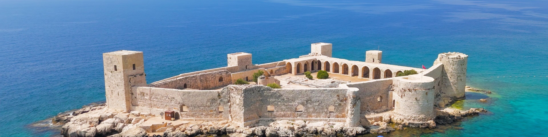 Kizkalesi, Mersin, Turkey. Maiden Castle island fortress completely surrounded by water, medieval architecture in mediterranean sea.. Aerial View