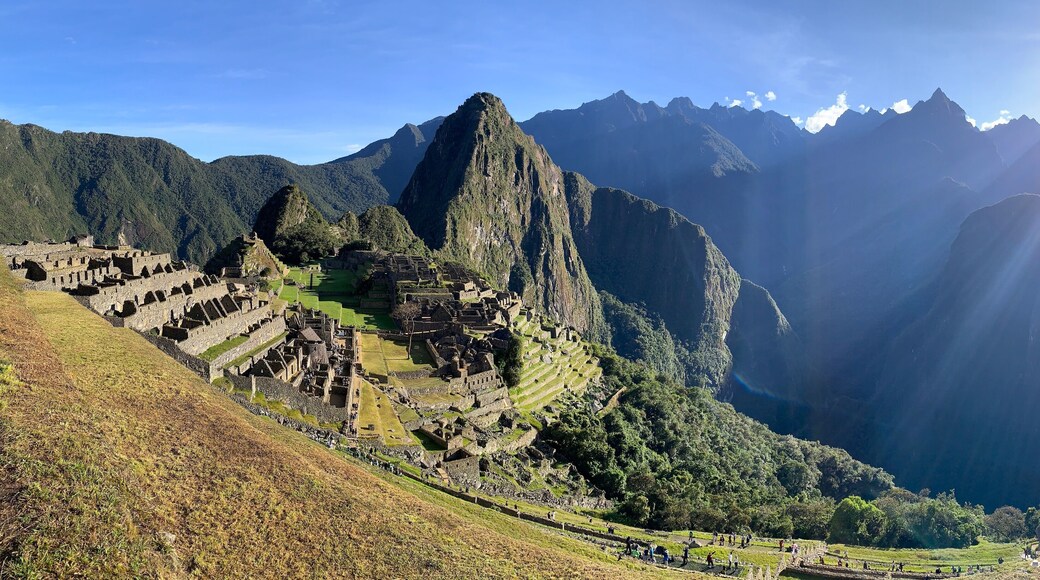Aguas Calientes, Peru - May 27, 2025: Panoramic view of UNESCO World Heritage Site Machu Picchu with ancient houses, agricultural terraces, Huayna Picchu mountain and Urubamba Canyon.