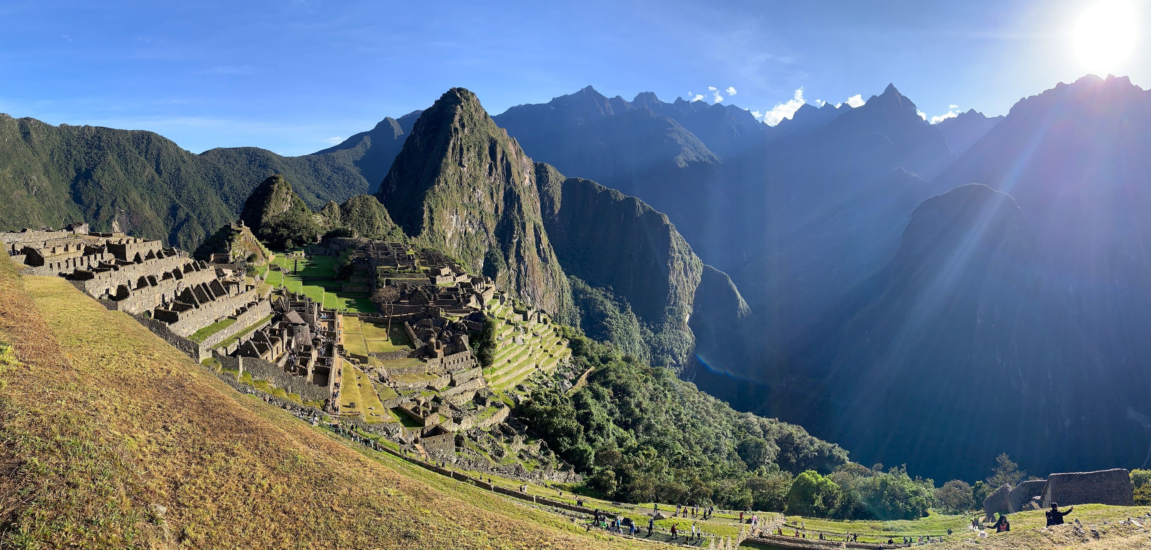 Machu Picchu, an ancient Incan city, with terraced fields and mountainous landscape.