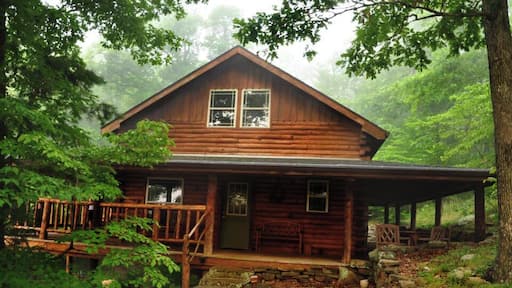 Nestled in the hills of Arkansas, within minutes of the Buffalo National River, is a hidden gem of a cabin. Boasting a wrap-around porch with hand peeled cedar, this cabin took 2 years to be built. A steady spring can be heard trickling into the pond below. And on summer nights the wild croaking can be heard from the pond's residents.
15 minutes from this cabin is Boxley Valley, home of the famous Arkansas Elk Herd. Horseback riding is also available on a 180 acre ranch. Don't forget to sign the guestbook if you choose to stay, guests from near and far have written about their travels and stay.