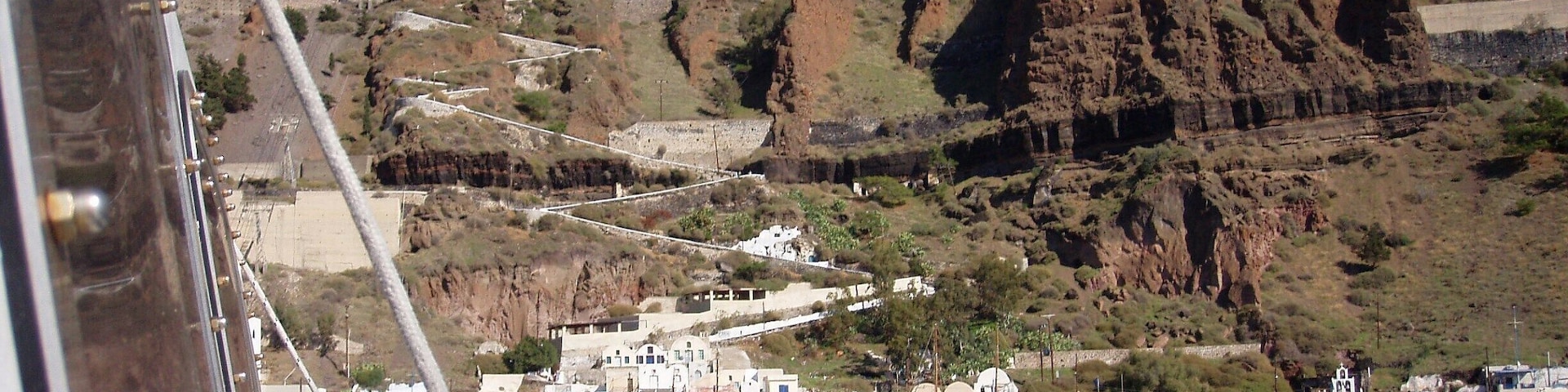 Grabbed this shot taking the ferry from the port of Santorini to an Island close by. That zig zag path you see is how you in the old days got to the town of Fira, They now have a cable car. But if you care for the hike, there are 588 stairs and takes a couple hours! Great view, love this place! just watch out for the donkey doo... you'll see. Enjoy