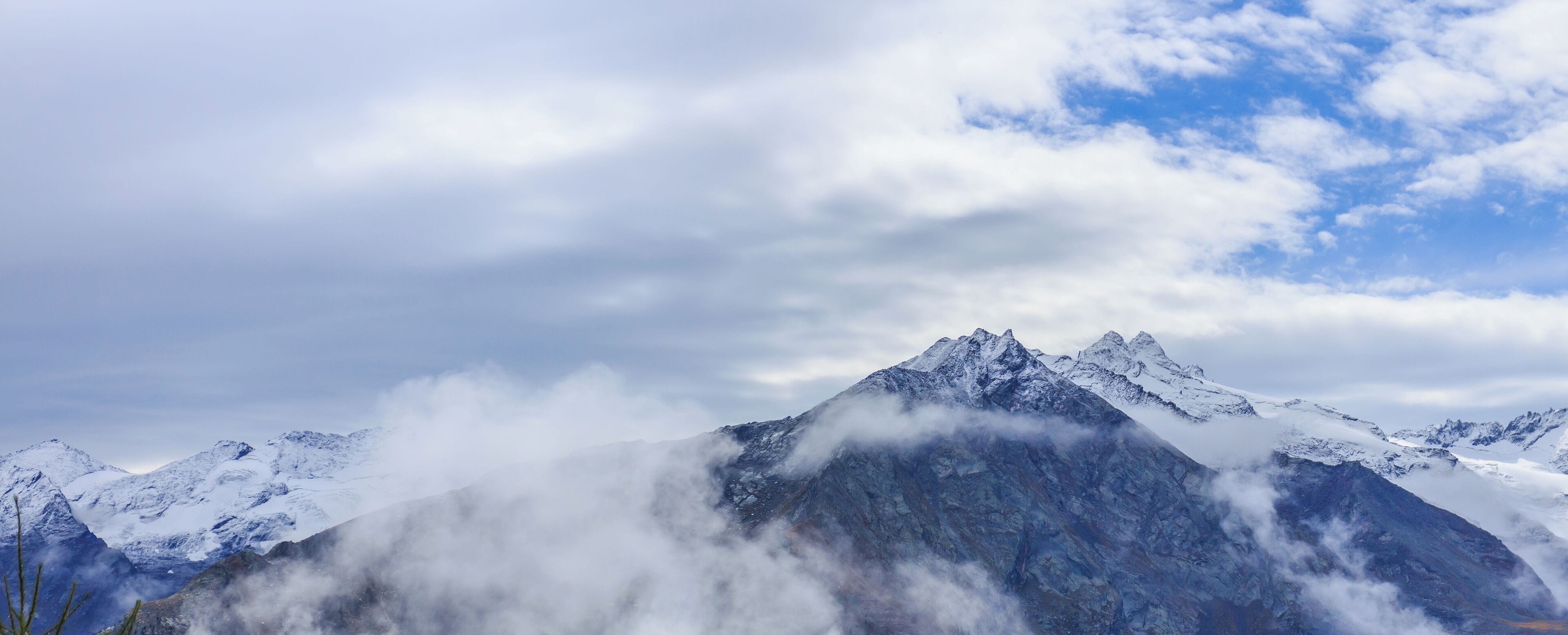 Mountain hike of Gimillan (1805m.) At Colle Tsa Sètse Cogne Valley (Italy). View of the surrounding Alpine peaks of Gran Paradiso.