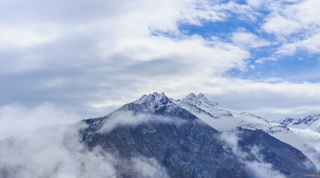 Mountain hike of Gimillan (1805m.) At Colle Tsa SĂštse Cogne Valley (Italy). View of the surrounding Alpine peaks of Gran Paradiso.