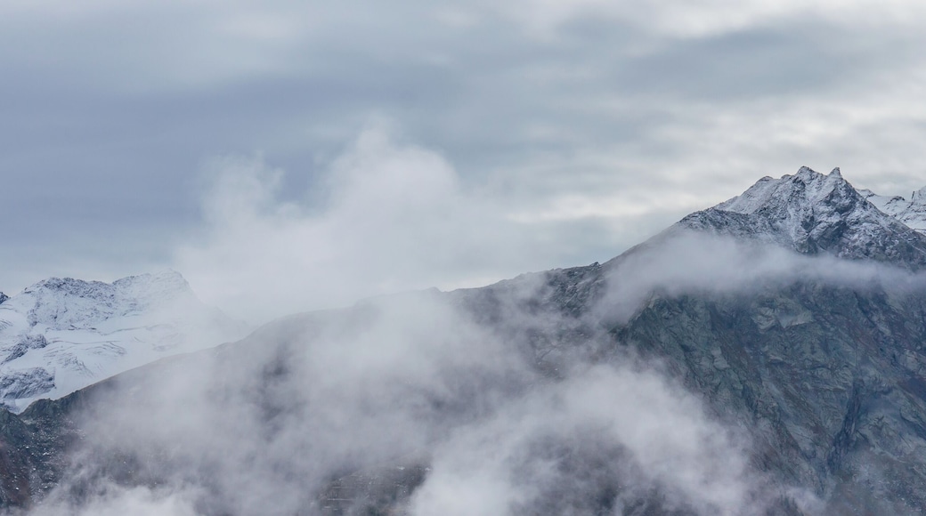 Mountain hike of Gimillan (1805m.) At Colle Tsa SĂštse Cogne Valley (Italy). View of the surrounding Alpine peaks of Gran Paradiso.
