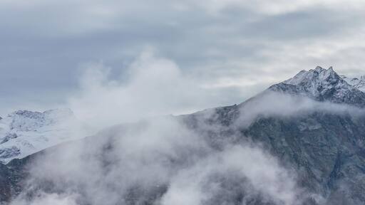 Mountain hike of Gimillan (1805m.) At Colle Tsa Sètse Cogne Valley (Italy). View of the surrounding Alpine peaks of Gran Paradiso.