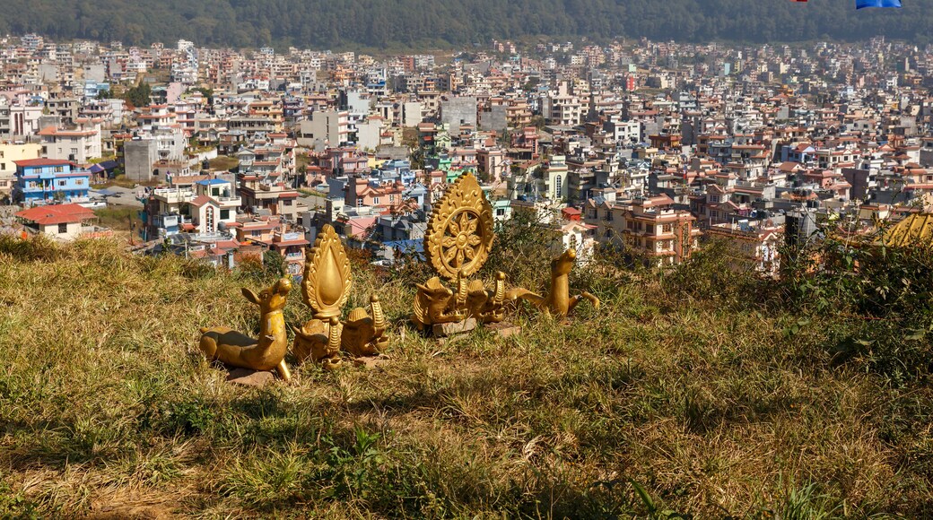 Buddhist symbols on a hill against the background of the city of Kathmandu, Nagarjun Nepal.