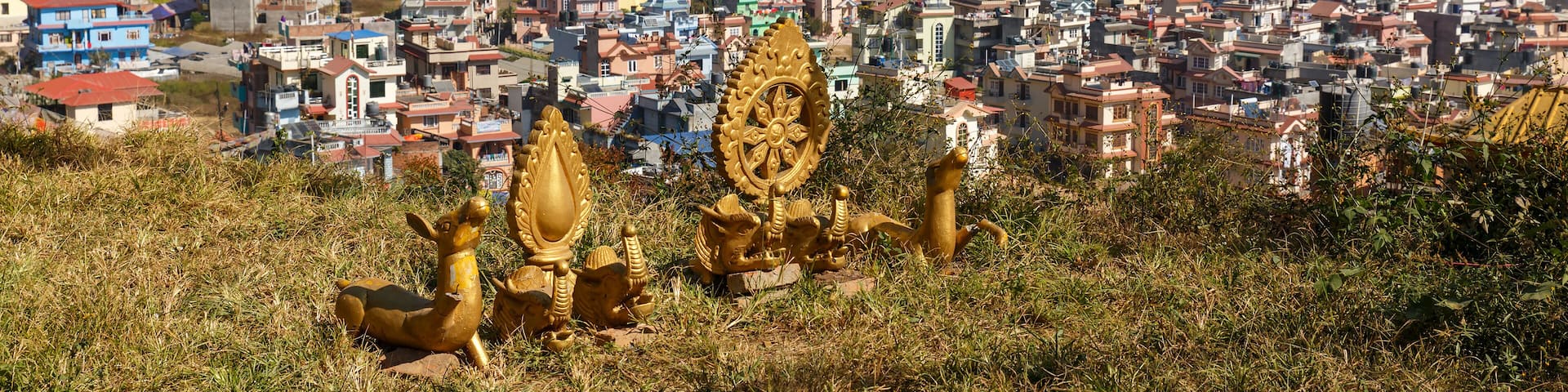 Buddhist symbols on a hill against the background of the city of Kathmandu, Nagarjun Nepal.