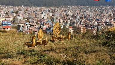 Buddhist symbols on a hill against the background of the city of Kathmandu, Nagarjun Nepal.