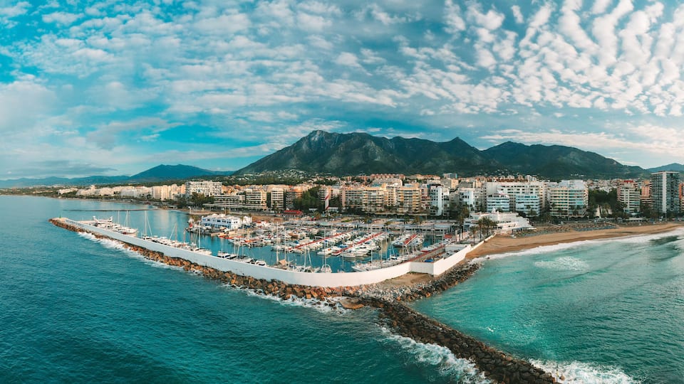 Aerial panoramic view of Puerto Banus marina with luxury yachts, Marbella, Spain