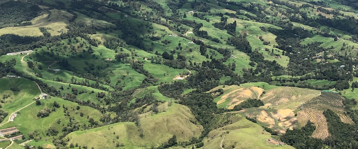 View from the sky doing tandem paragliding near Medellín