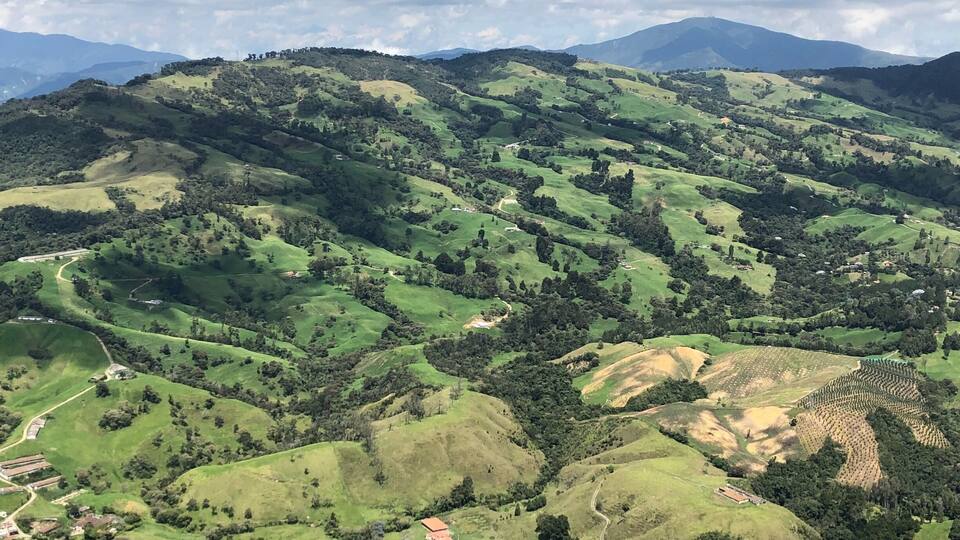 View from the sky doing tandem paragliding near Medellín
