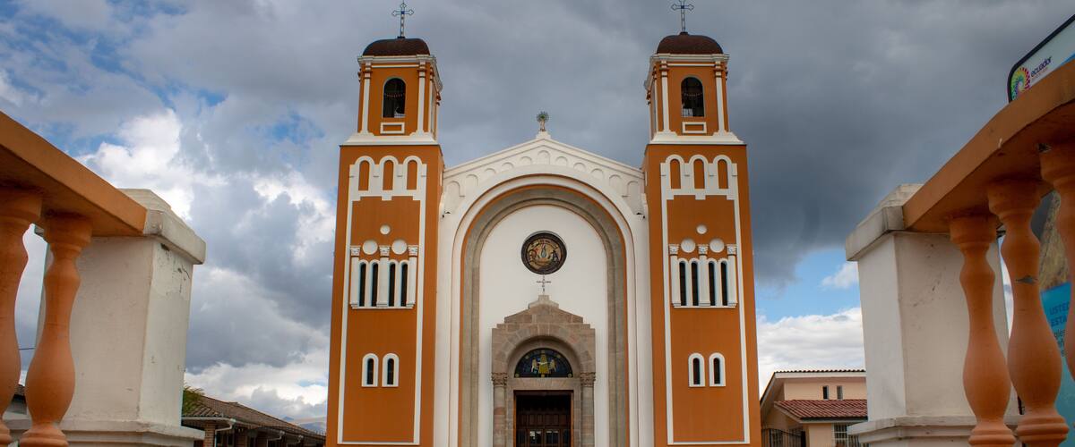 A church with two bell towers and a large arched entrance.