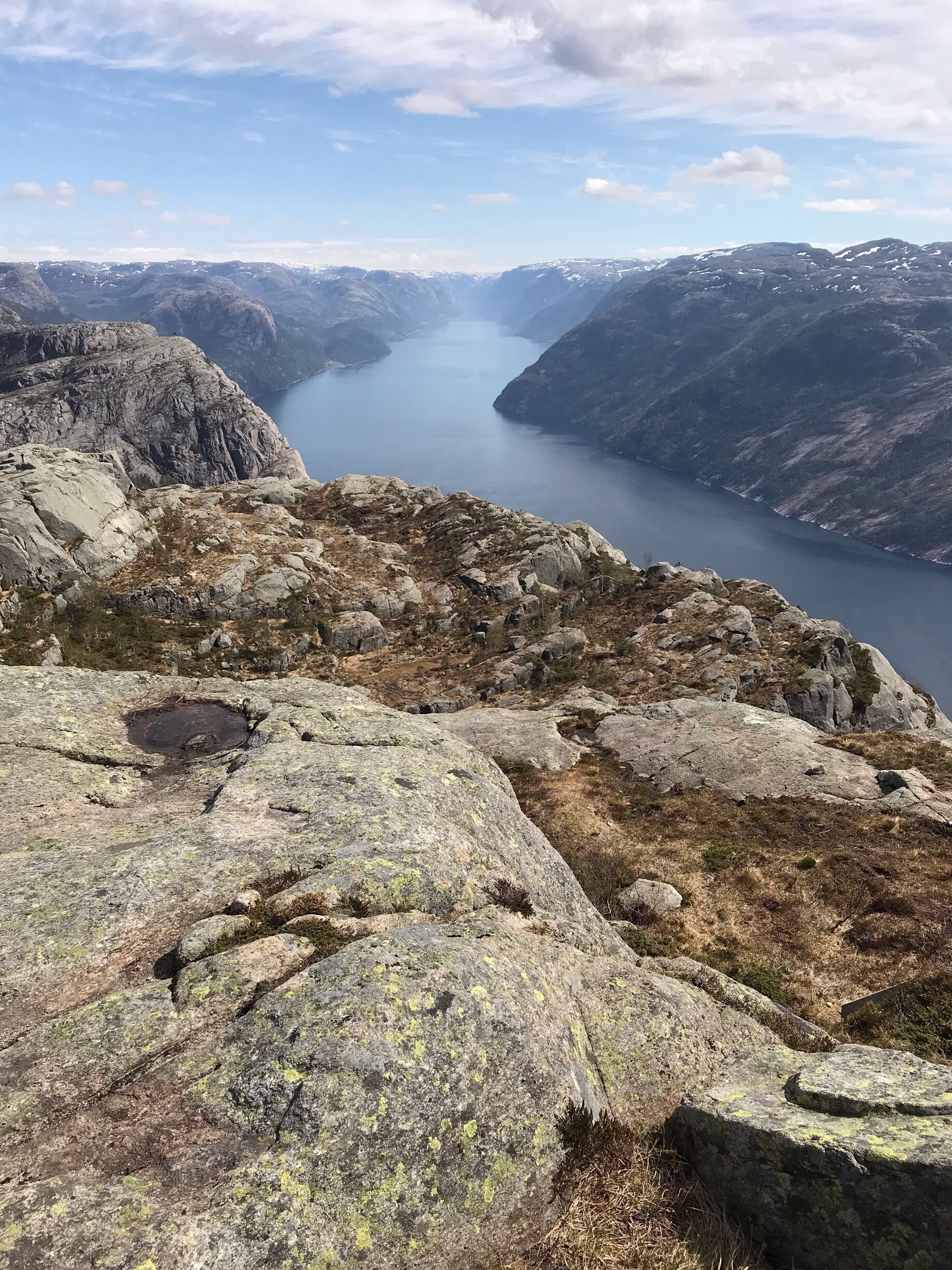 A mountainous landscape with a lake and rocky terrain.