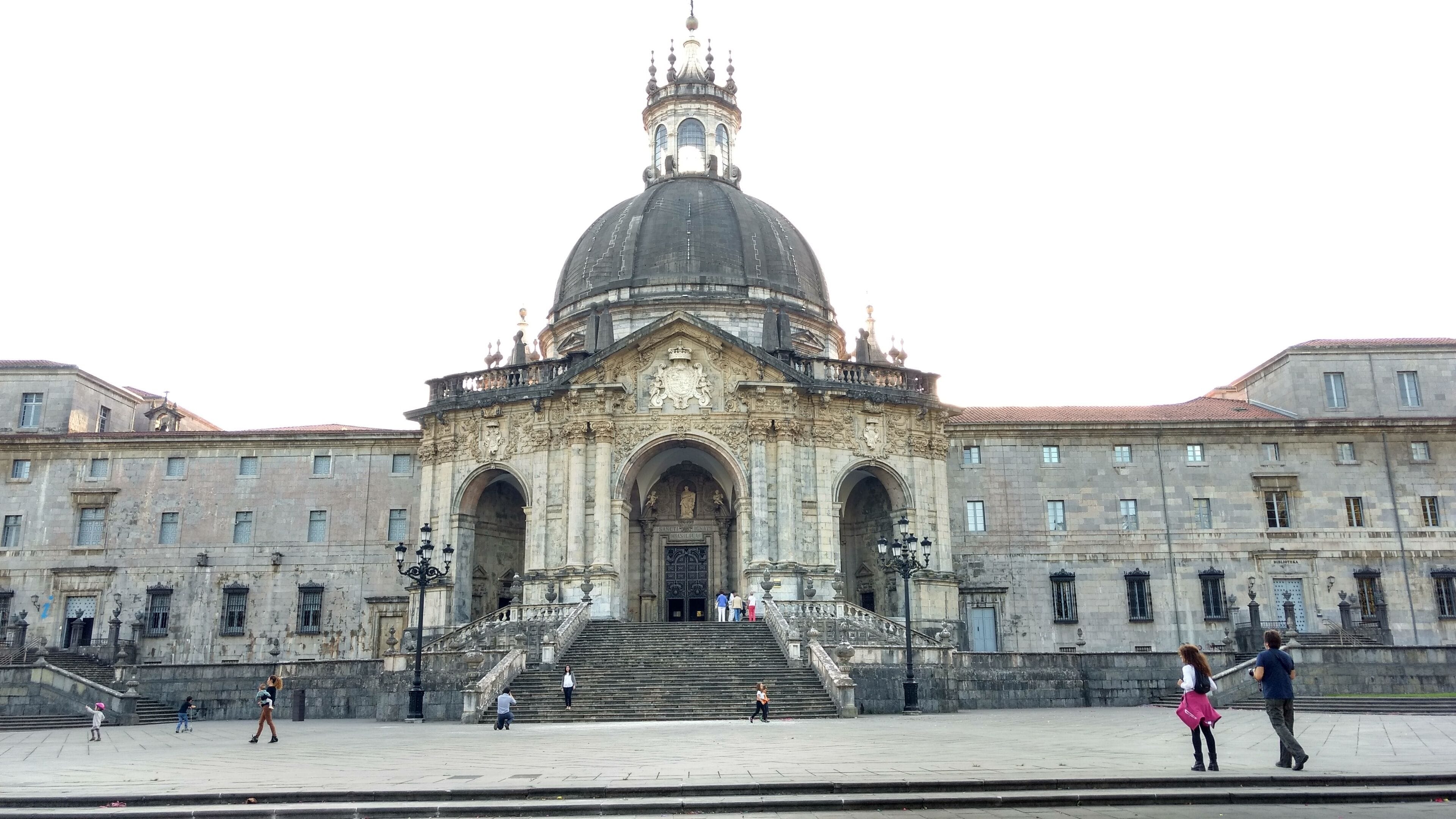 A historic building with a large dome and a bell tower.
