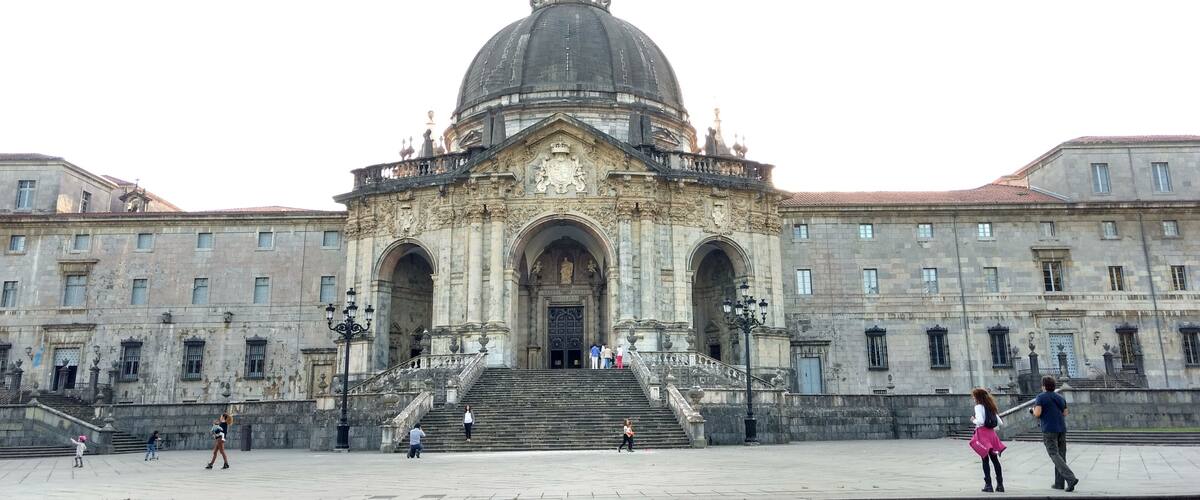 A historic building with a large dome and a bell tower.