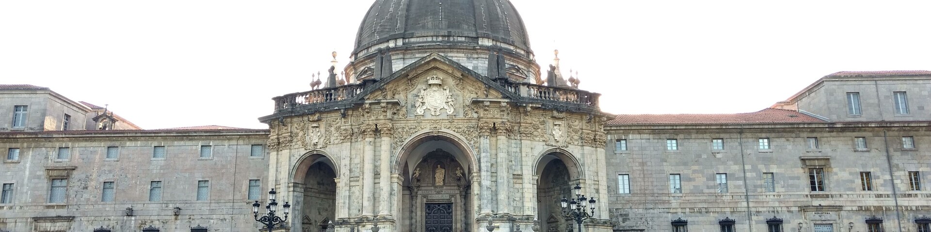 A historic building with a large dome and a bell tower.
