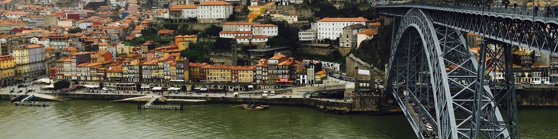 A cityscape with a prominent bridge spanning a river.