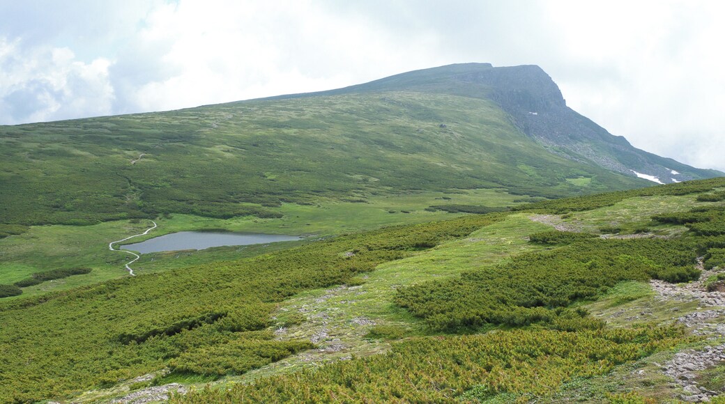 Mount Chubetsu (Chubetsu-dake) and Chubetsu Pond (Chubetsu-numa) seen from the Daisetsu Mountains traverse trail in Hokkaido, Japan