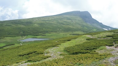 Mount Chubetsu (Chubetsu-dake) and Chubetsu Pond (Chubetsu-numa) seen from the Daisetsu Mountains traverse trail in Hokkaido, Japan
