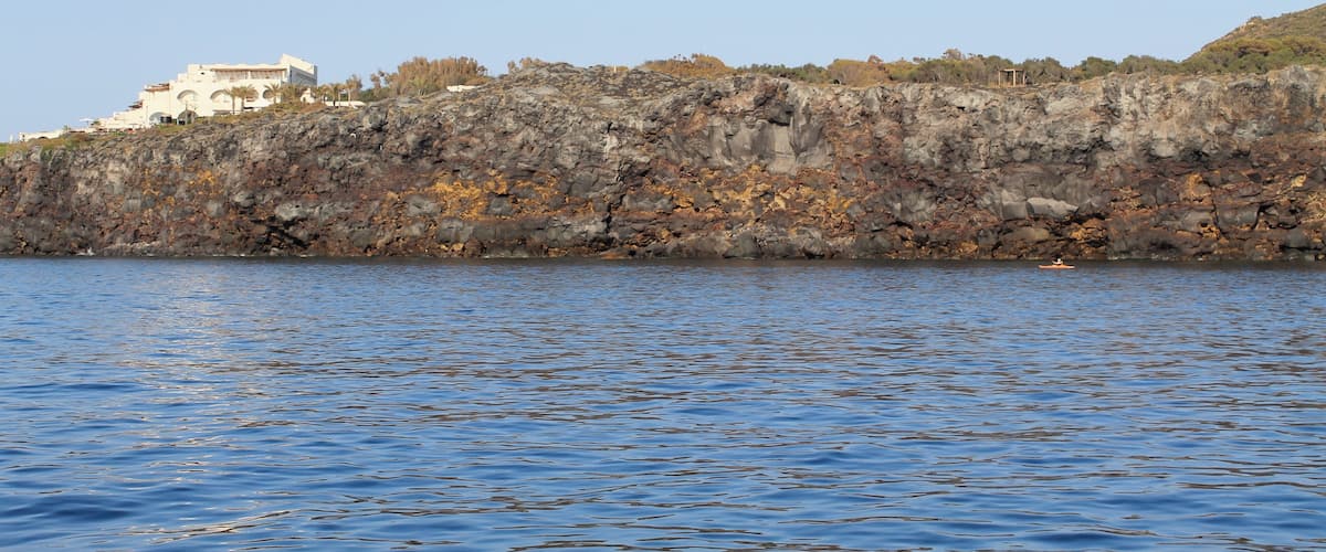 Sailing toward Porto di Ponente , along the coast of Vulcanello
