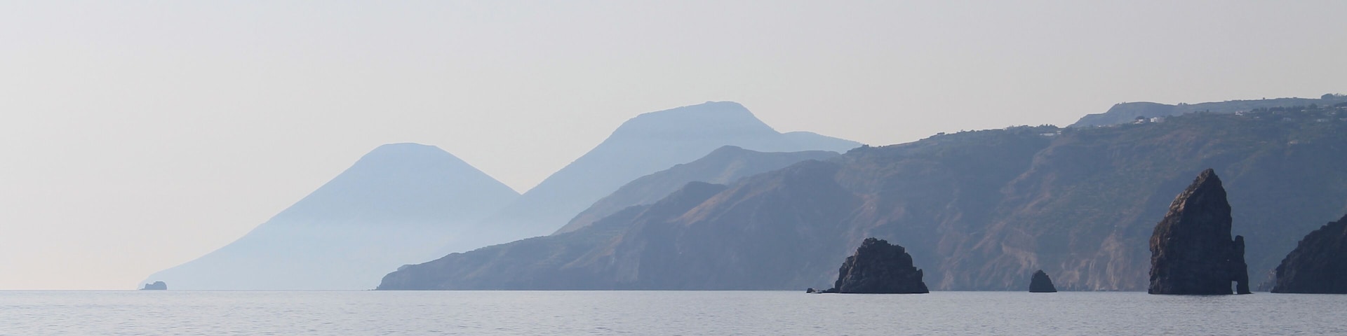 Sailing toward Porto di Ponente , along the coast of Vulcanello