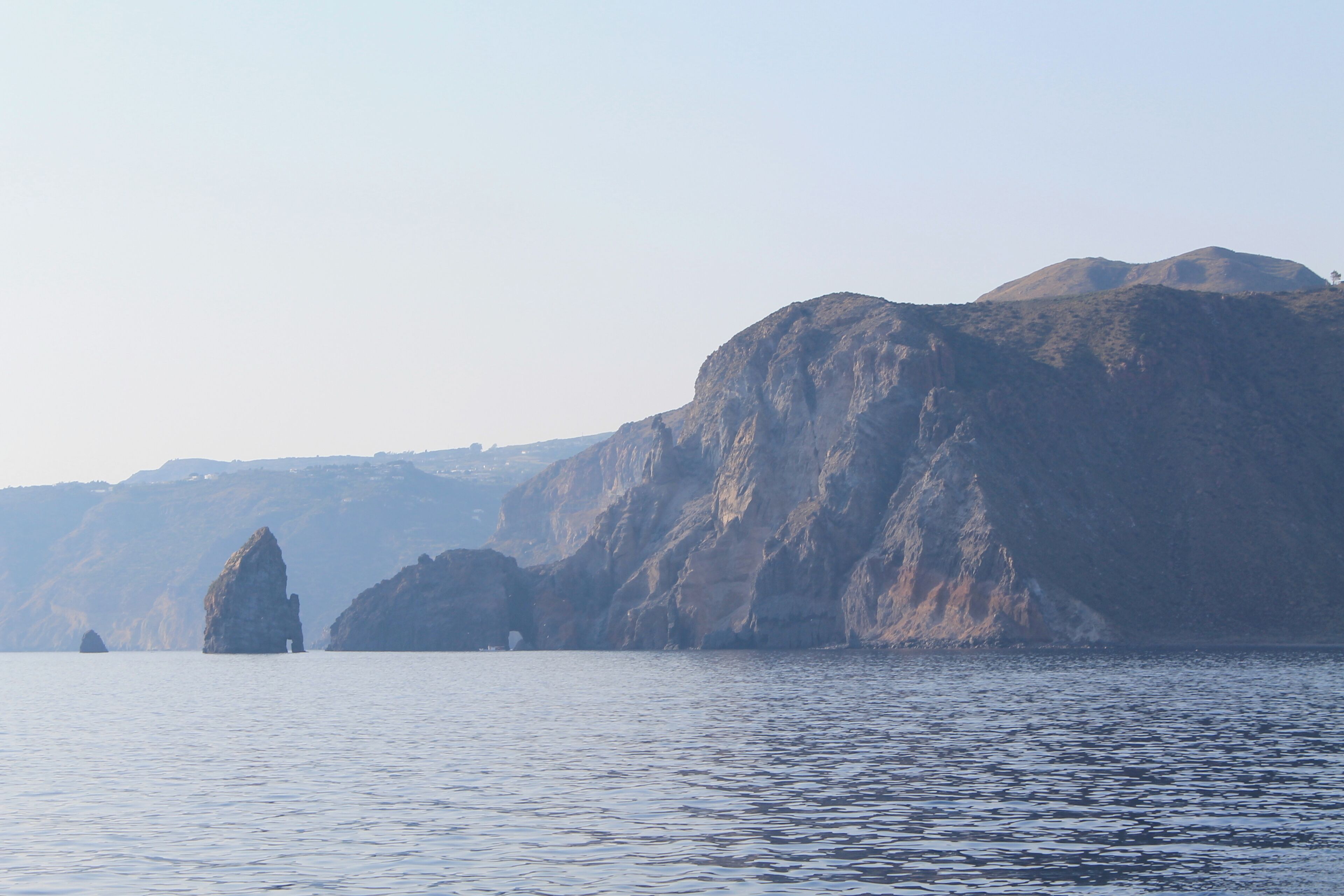 Sailing toward Porto di Ponente , along the coast of Vulcanello