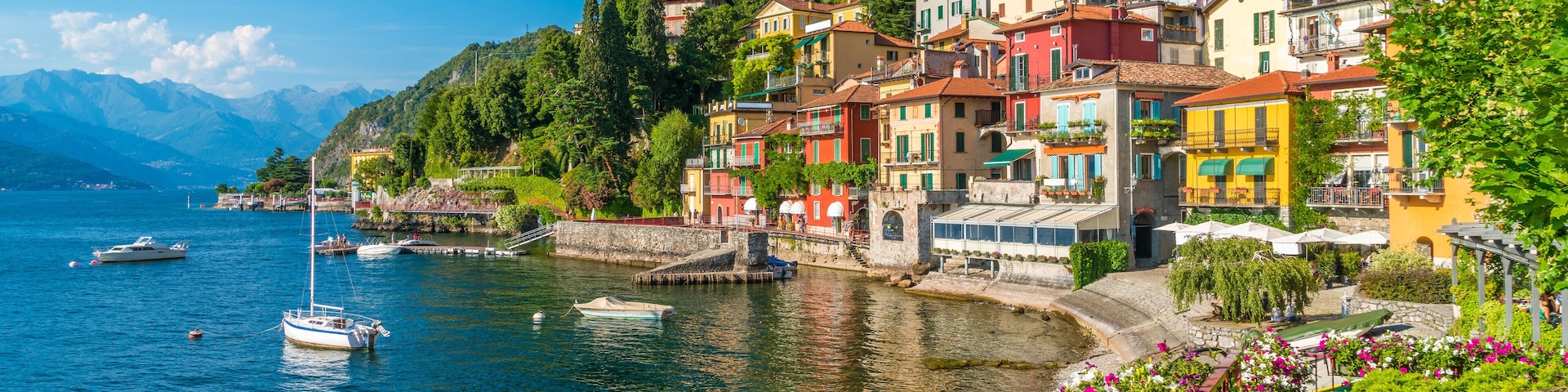 Beautiful Varenna waterfront on a sunny summer afternoon, Lake Como, Lombardy, Italy.
