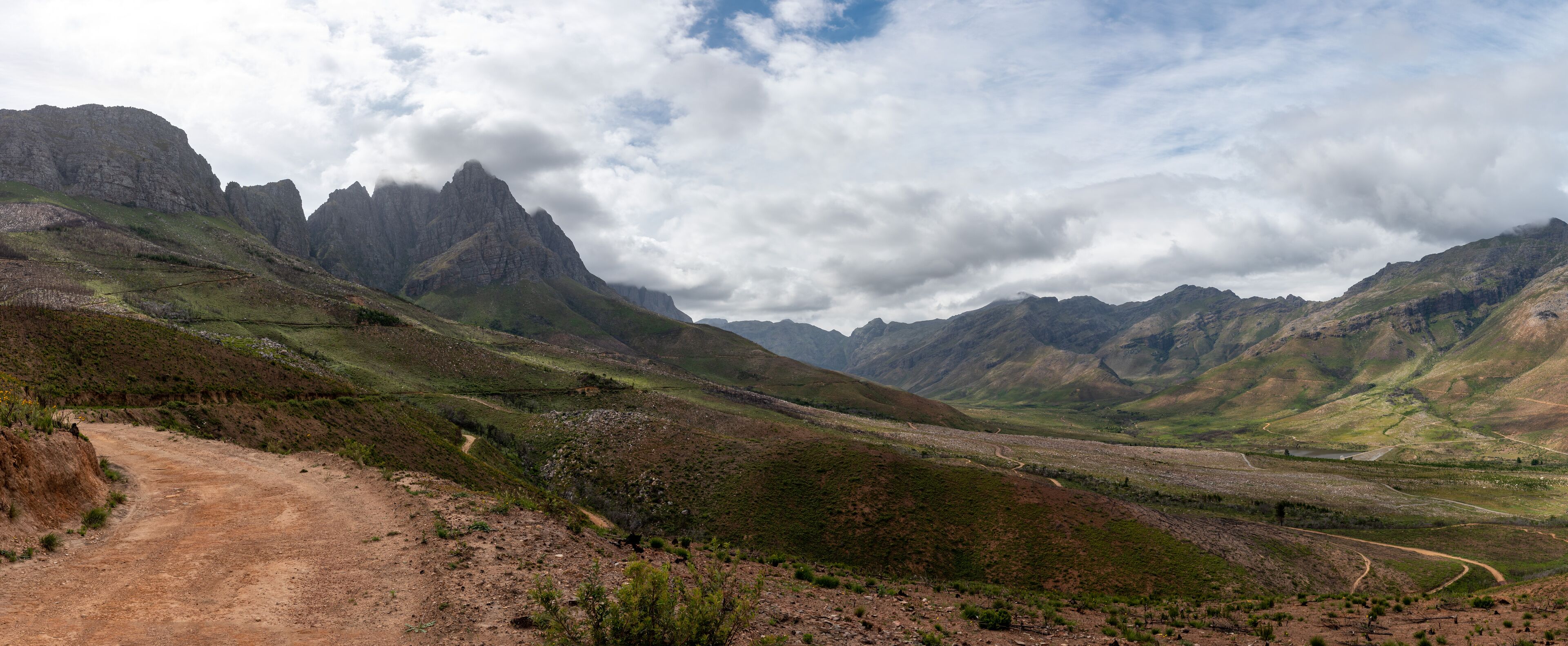 Panoramic view of scenic mountains and valleys in Jonkershoek nature reserve, Western Cape, South Africa.