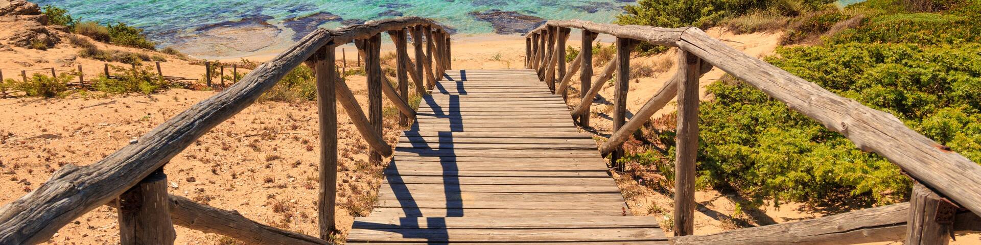 The most beautiful beaches of Italy. Campomarino dune park: fence between sea dunes,Taranto (Apulia). The protected area extends along the entire coast of the town of Maruggio.