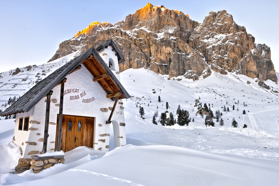 Small white church at Passo Falzarego near La Villa village, Dolomites Mountains,  Italy