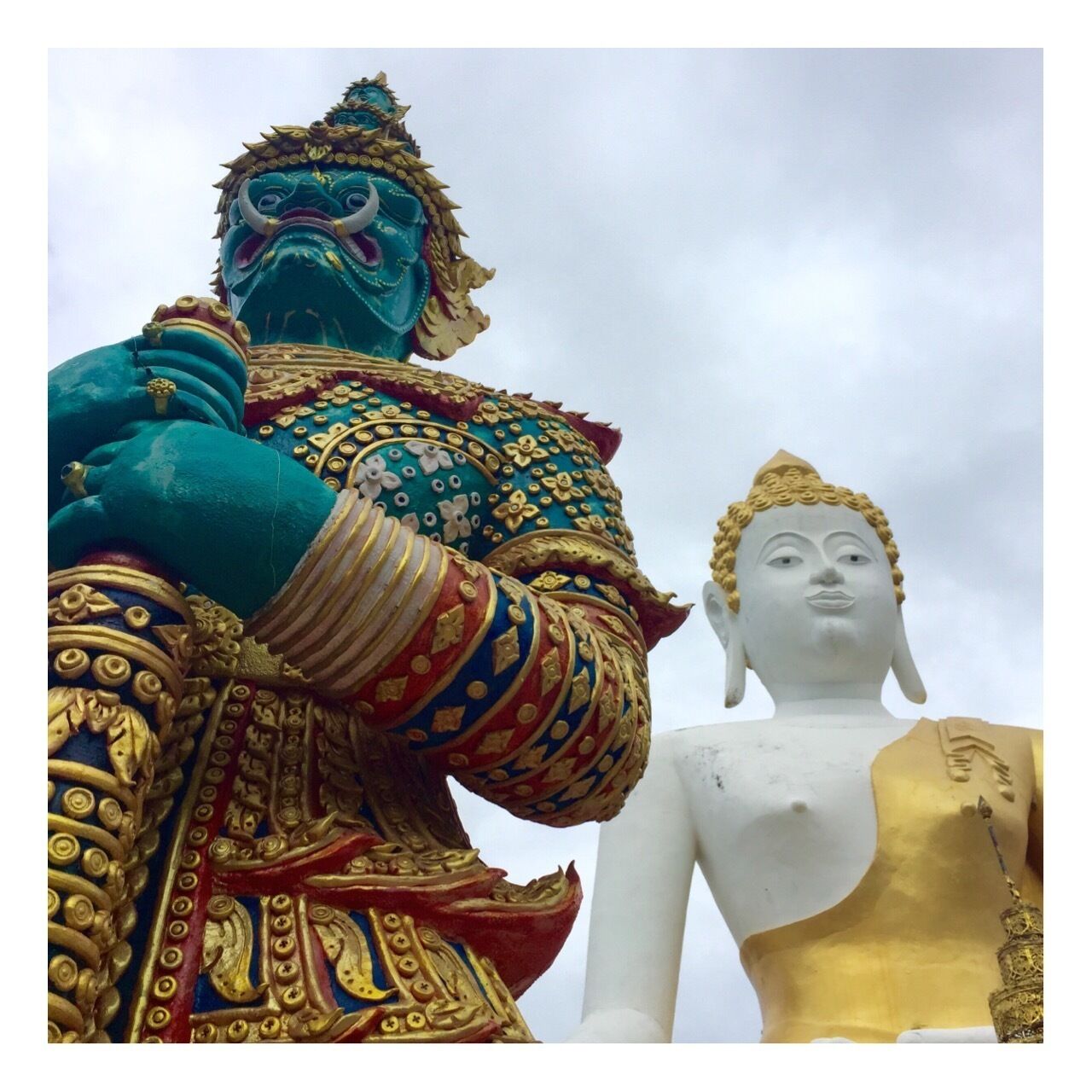 Buddha and his protector. this picture does not do justice to these stories high gigantic impressive statues. 