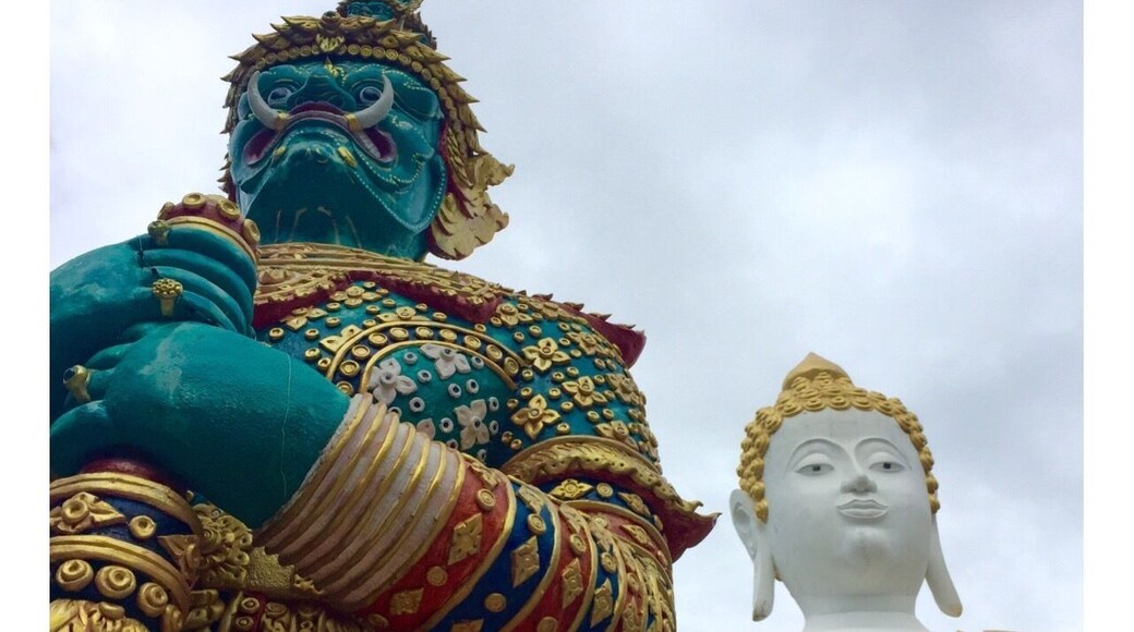 Buddha and his protector. this picture does not do justice to these stories high gigantic impressive statues.