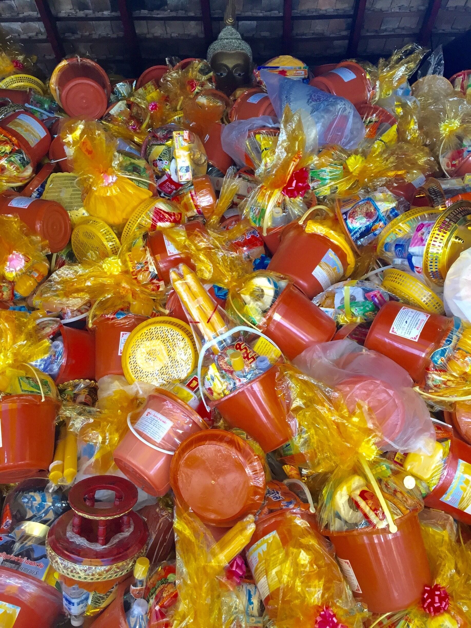 in just two days of this holiday, offerings to the monks are piled high and spilling out onto the temple floor. beautiful display of gratitude. 
#colorful