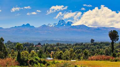 Beautiful view of Mount Kenya, highest mountain in Kenya at 5199 meters rising from the central highlands on a crisp and bright winter day as seen from Nanyuki area on the equator in Kenya