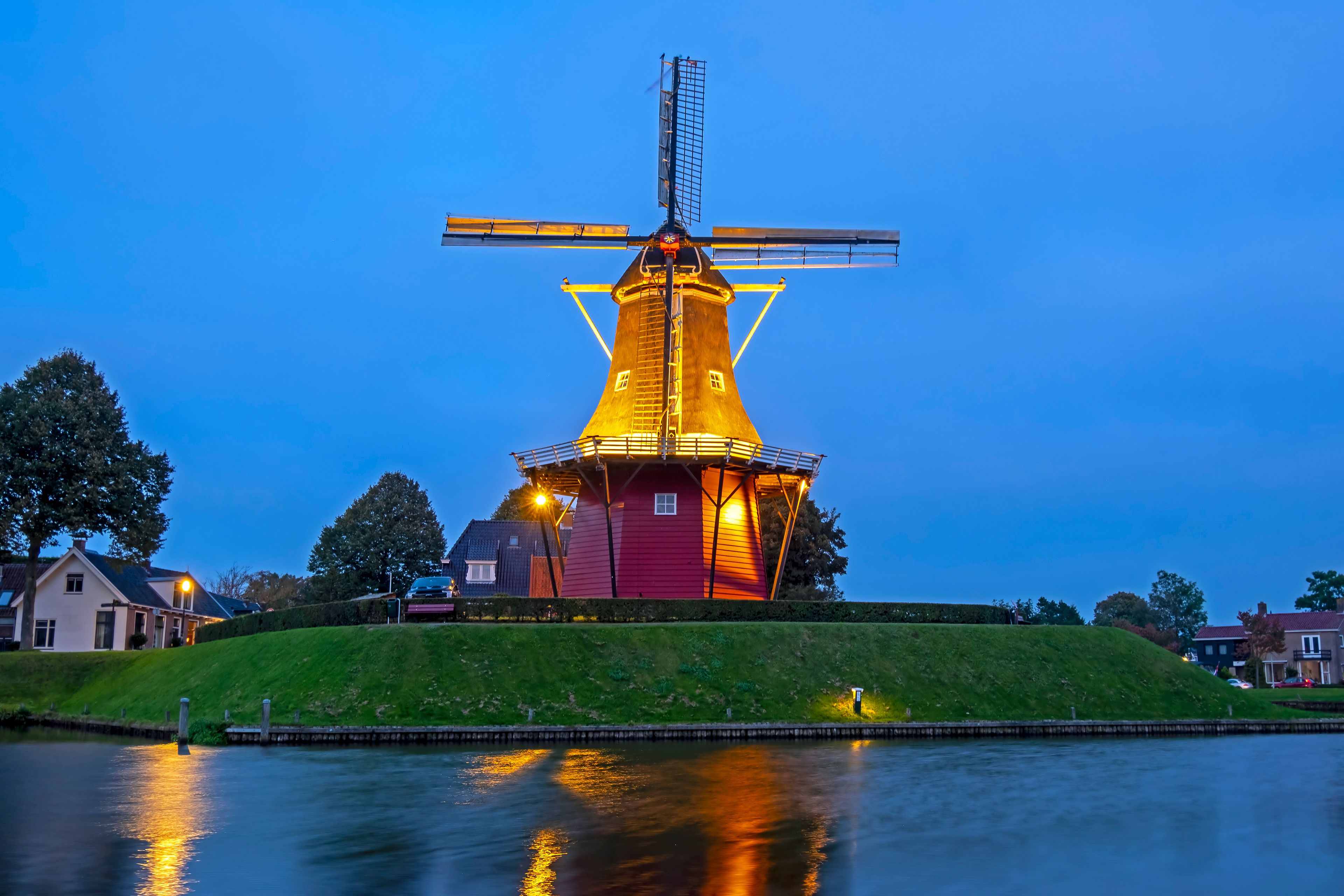 Windmill De Hoop in the historical city Dokkum in the Netherlands at sunset