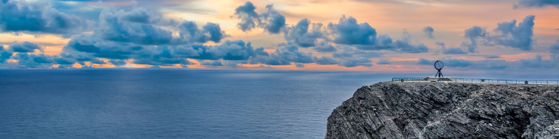 Midnight sun at North Cape Nordkapp on the northern point of Norway and Europe with Barents Sea, a part of Atlantic Ocean
