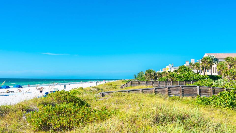 Indian rocks beach with green grass in Florida, USA