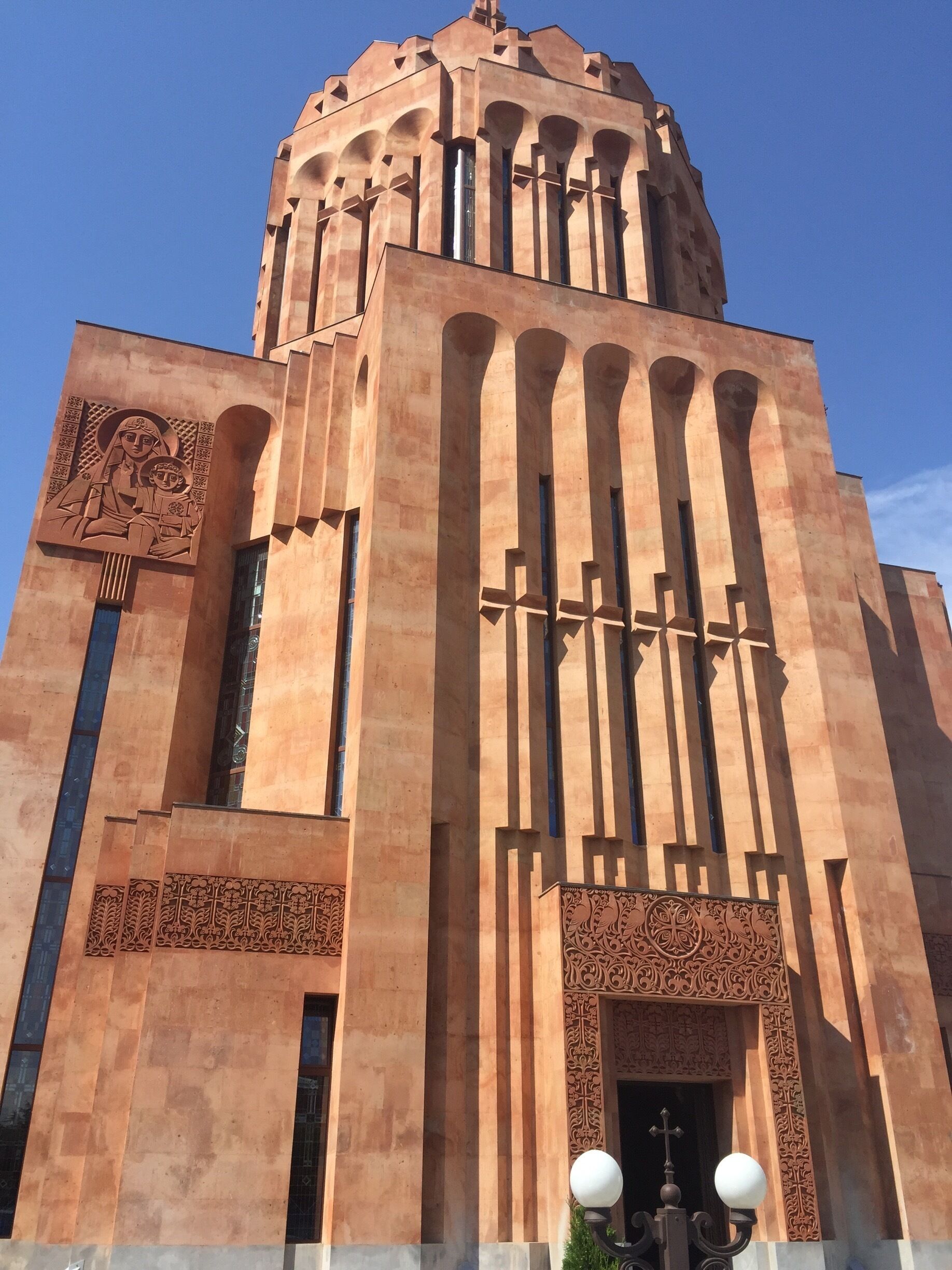 A large, ornate building with tall columns and intricate carvings.