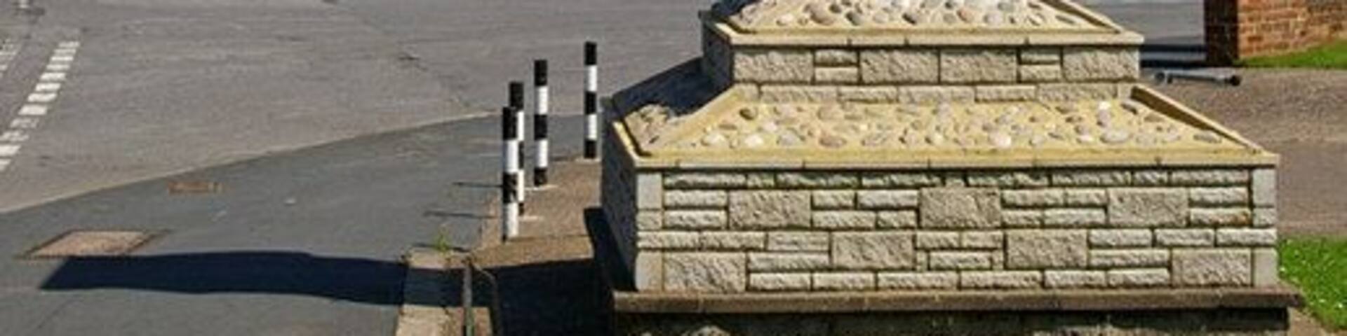 Brougton Silver Jubilee Clock. This clock stands on the corner of High Street and Estate Avenue.