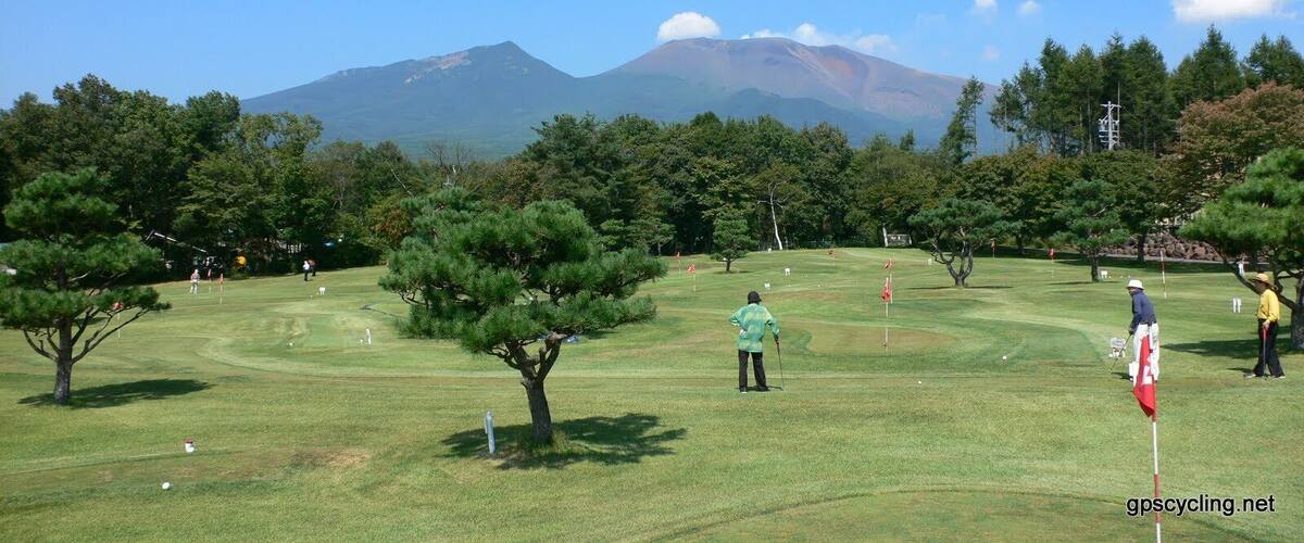 A golf course with a mountain in the background.
