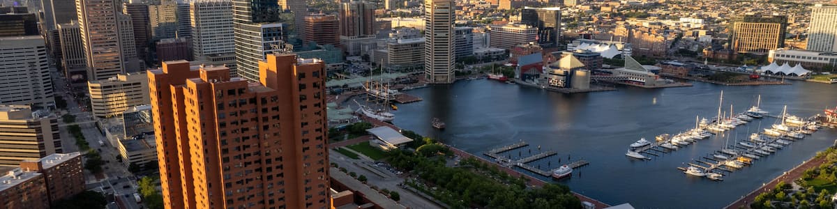 Aerial Drone View of Baltimore City Harbor at Sunset