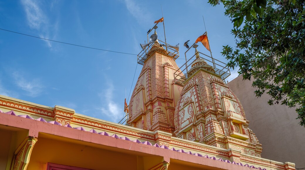 An exterior shot of a local Hindu temple in the suburban neighbourhood of Kharadi, showcasing traditional Indian temple architecture, intricate carvings and devotional details.