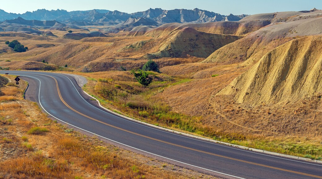 Yellow Mounds with highway in summer, Badlands national park, South Dakota, USA.