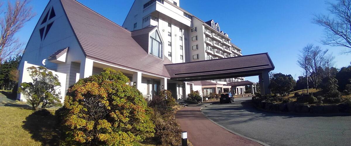A modern building with a triangular roof and a covered walkway.