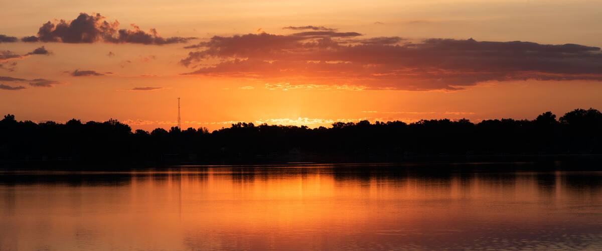 Michigan summer sunrise. Upper Crooked Lake