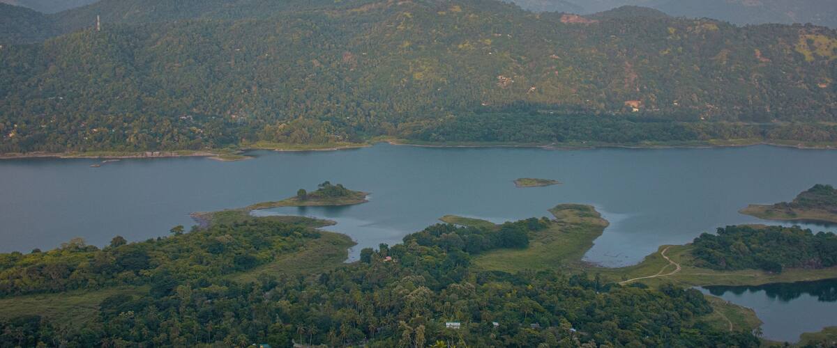 A mountainous landscape with a large lake and several small islands.