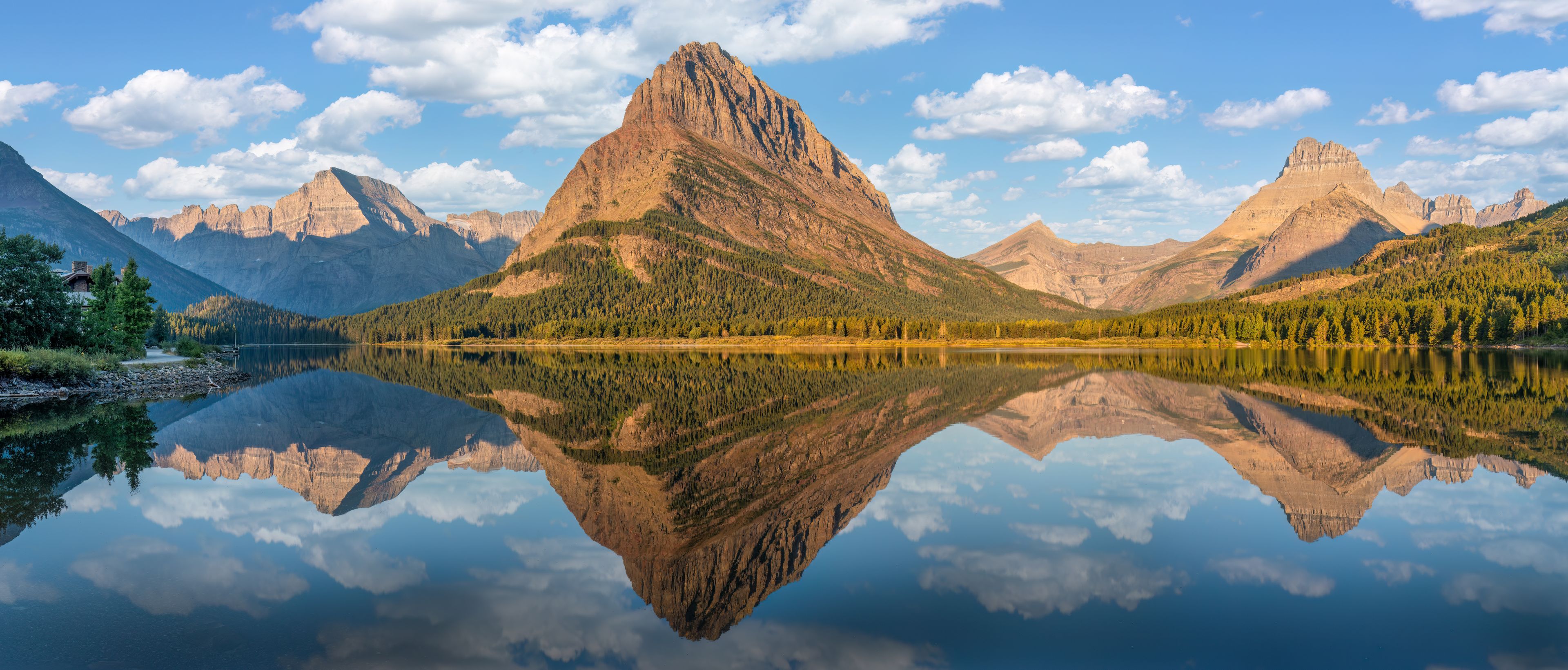A mountain range with a lake reflecting the peaks.