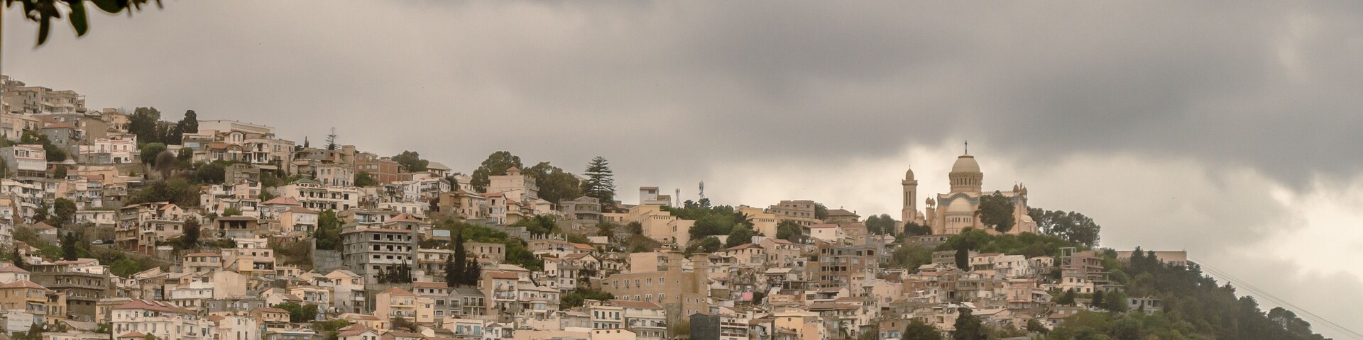 Wide angle panorama of Algiers, Alger, Algeria, with Notre Dame d'Afrique (English : Our Lady of Africa) in the background.